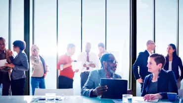 Group of people having a business meeting in a modern office.